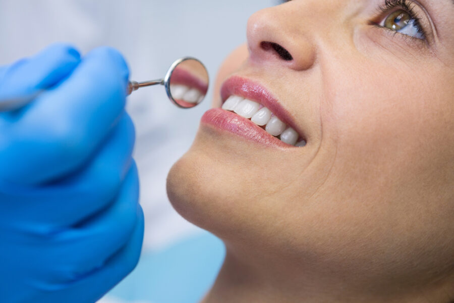 Woman smiling after dental cleaning in Auburn, CA